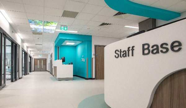 Staff and a patient open the new UTC for Swindon